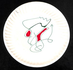 Very abstract doodle of squiggly lines drawn on a paper plate.